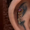 Tattooed ear with wine red rhodolite garnet gemstone pushpin earrings. By @AdornedByAmelia on @RachelCantaTattoo